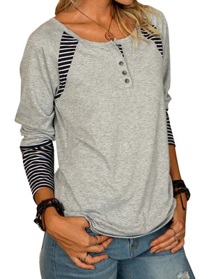 Gray raglan henley tee with button detail and striped long sleeves.