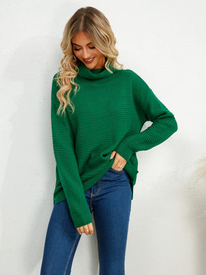 Textured knit oversized turtleneck pullover in dark green, acrylic, with a relaxed fit and casual styling.