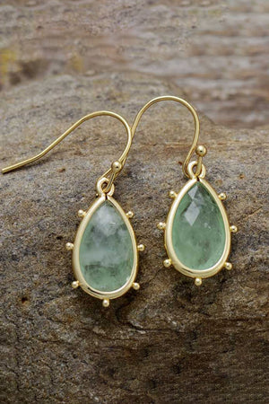 Light green teardrop earrings with gold detailing and beaded accents.
