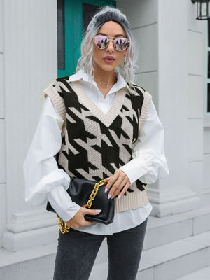 Houndstooth knit v-neck pullover vest in black and beige acrylic.
