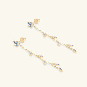 Gold dangling crystal vine earrings with delicate chain and sparkling accents.