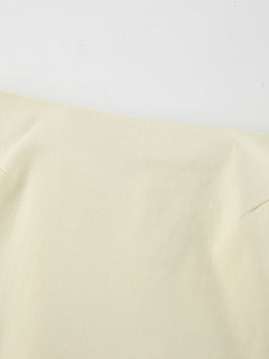 Chic cotton midi skirt in beige with a subtle slit detail.
