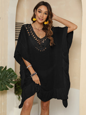 Black crochet yoke ruffle hem cover-up with V-neck and short sleeves.