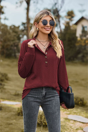 Textured knit polo shirt in Burgundy with button detail and long sleeves.