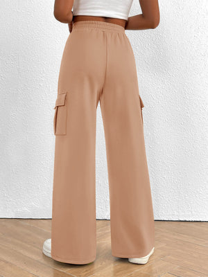 Apricot high waist cargo sweatpants with drawstring and flap pockets.