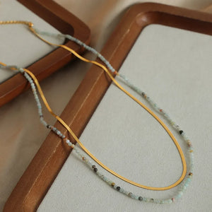 Gold layered necklace set with serpentine chain and beaded detail
