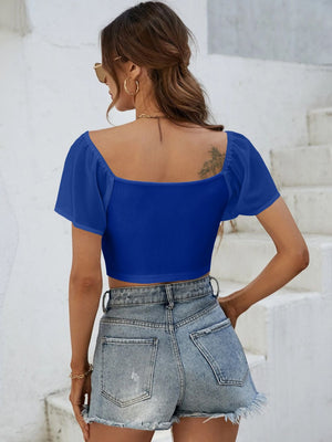 Royal blue ribbed crop top with chiffon sleeves and square neckline.