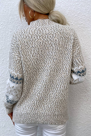 Nordic Fair Isle mock neck knit sweater in Sand with diamond pattern and blue cuff detail.