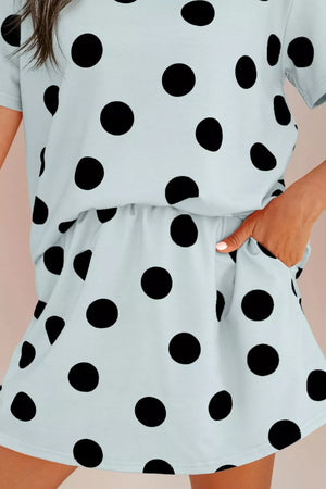 Light blue polka dot two-piece outfit set with crew neck top and shorts with pockets.