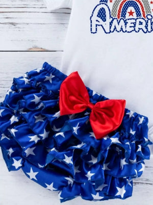 Baby bloomer set with ruffled star pattern and red bow detail.