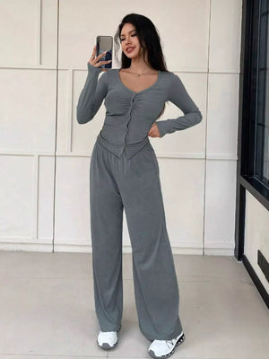Gray button-down ruched top with long sleeves and wide-leg pants set.