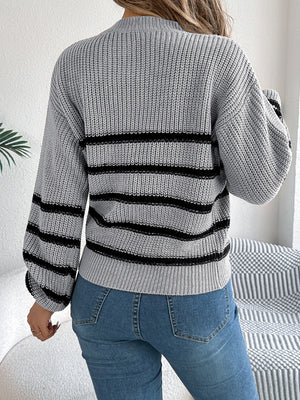 Gray striped knit sweater with mock neck and balloon sleeves.