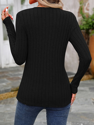Black ribbed long sleeve top with round neck and button detail