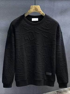 Black crewneck sweatshirt with embossed geometric texture and ribbed cuffs and hem.