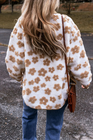 White sherpa jacket with brown floral pattern and corduroy trim detail.