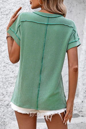 Green vertical ribbed tee with split hem and short sleeves.