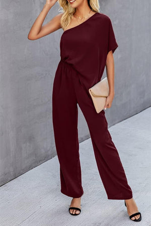 Burgundy asymmetric drape-sleeve wide-leg jumpsuit with elastic waist