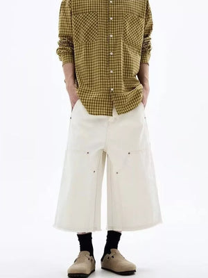Men's white cotton wide-leg cropped cargo pants with raw hem