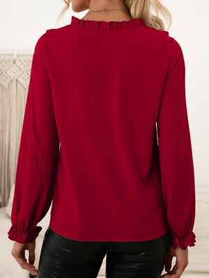 Burgundy ruffled yoke blouson sleeve top with ruffled cuffs.