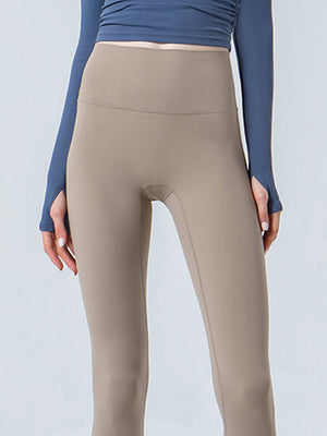 Beige sculpted crop leggings with a high waistband and subtle seam details.