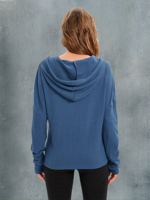 Dusty blue waffle knit relaxed fit hoodie with hood and long sleeves.