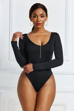 Black long sleeve bodysuit with plunge neckline and zip front detail.