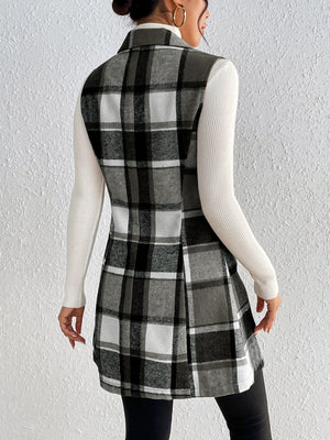 Sleeveless plaid blazer dress in black and white, with a collared neckline and A-line skirt.