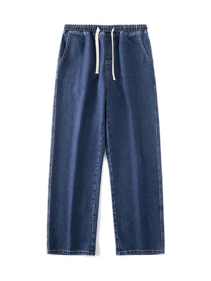 Relaxed wide-leg jeans in dark blue denim with a drawstring waist.