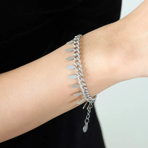 Silver oval link bracelet with dangling leaf charms and adjustable chain