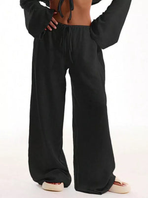 Black maternity wide-leg pants with drawstring waist and relaxed fit