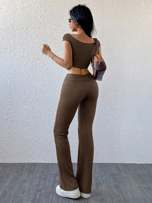 Ribbed off-shoulder crop top and flare pants set in chocolate brown.