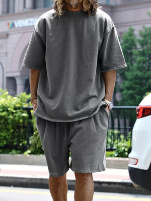 Men's relaxed fit two-piece set in dark gray with drawstring shorts and a crewneck tee.