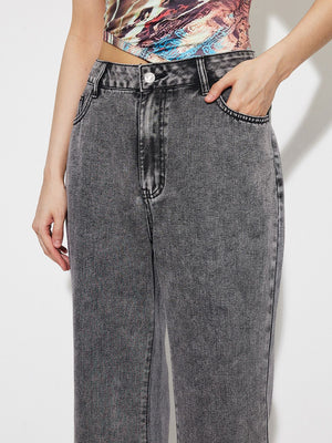 Acid wash high-rise flare jeans in dark gray cotton with button fly and pocket detail.