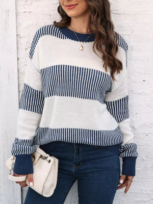 Cozy knit sweater with color block stripes in dark blue and white acrylic.