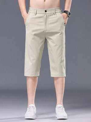 Men's apricot chino shorts with belt loops and pockets.