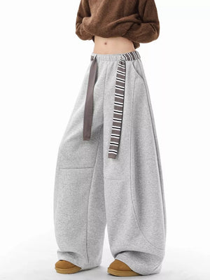 Grey wide-leg sweatpants with drawstring and striped waistband detail