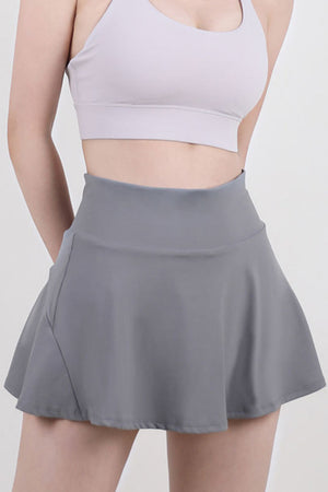 Dark Gray sculpted flared active skort with a high waist and breathable fabric.