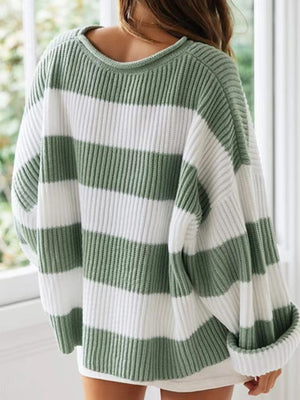 Striped oversized knit sweater in sage green and white with a crew neck.