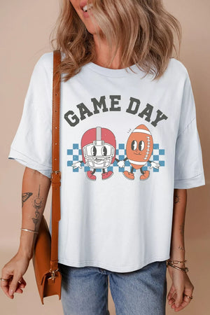 White cotton graphic t-shirt with "Game Day" text and cartoon football helmet and ball characters.