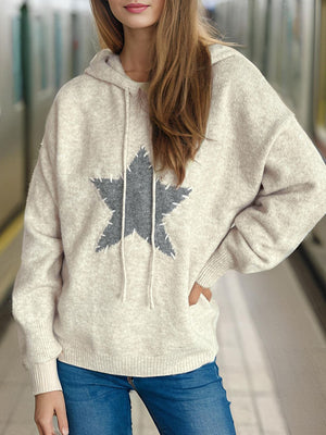 Beige knit hoodie with textured star appliqué and drawstring hood.