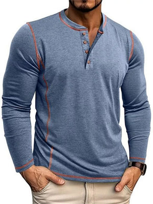 Men's blue long sleeve henley t-shirt with contrast stitching and button detail.
