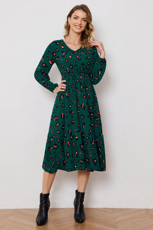 Emerald leopard print midi dress with v-neck, balloon sleeves, and tiered skirt.