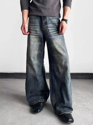 Men's blue distressed wide-leg denim jeans with a relaxed fit.
