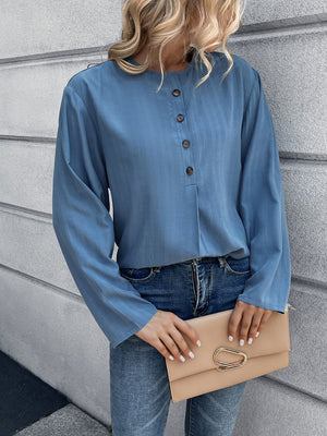 Dusty blue Mandarin collar blouse with button front and long sleeves.