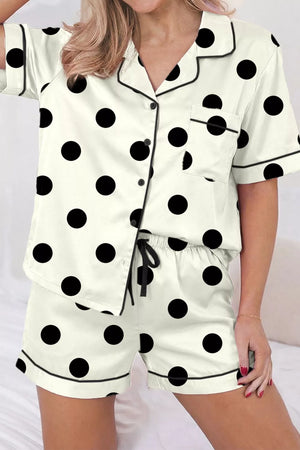Cream polka dot button-up pajama set with black trim and chest pocket.
