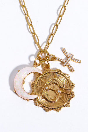 Gold zodiac pendant necklace with Pisces symbol, opal moon charm, and diamond accents.