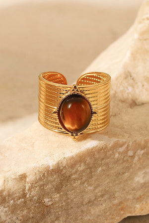 Textured gold cuff ring with oval brown tiger's eye stone