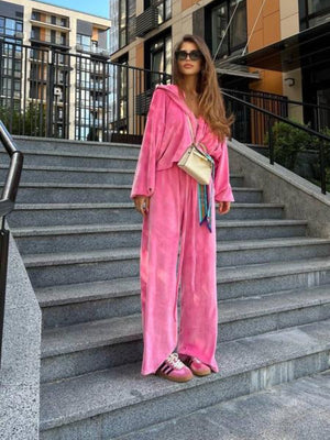 Plush velour lounge set in hot pink with wide leg pants and a hooded jacket.
