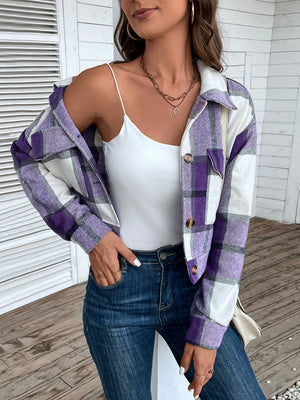 Checked plaid shacket in purple and white with button closure and patch pockets.