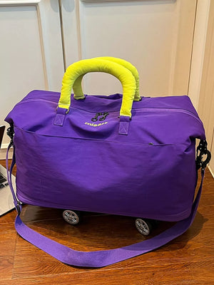 Vibrant purple travel bag with neon yellow handles and wheels
